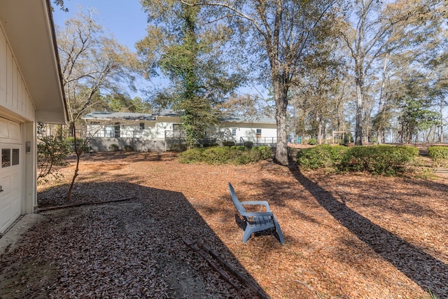 view of yard featuring a garage