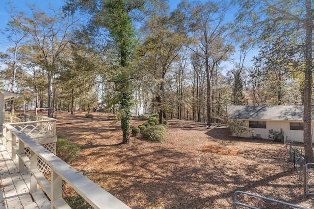 view of yard featuring a wooden deck