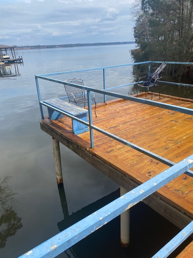 dock area featuring a water view