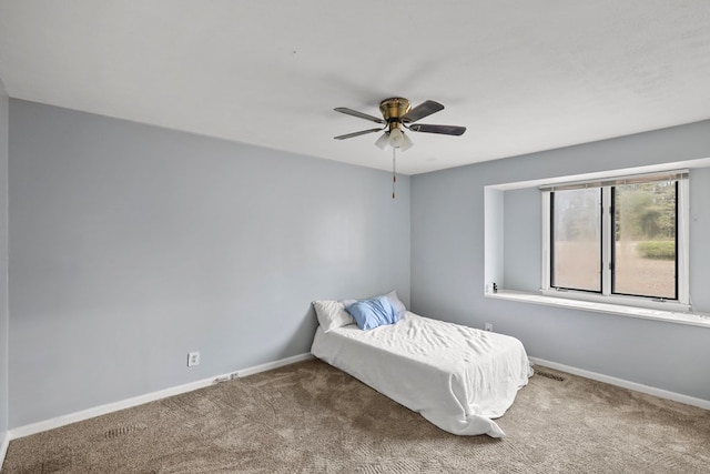 unfurnished bedroom with carpet and ceiling fan