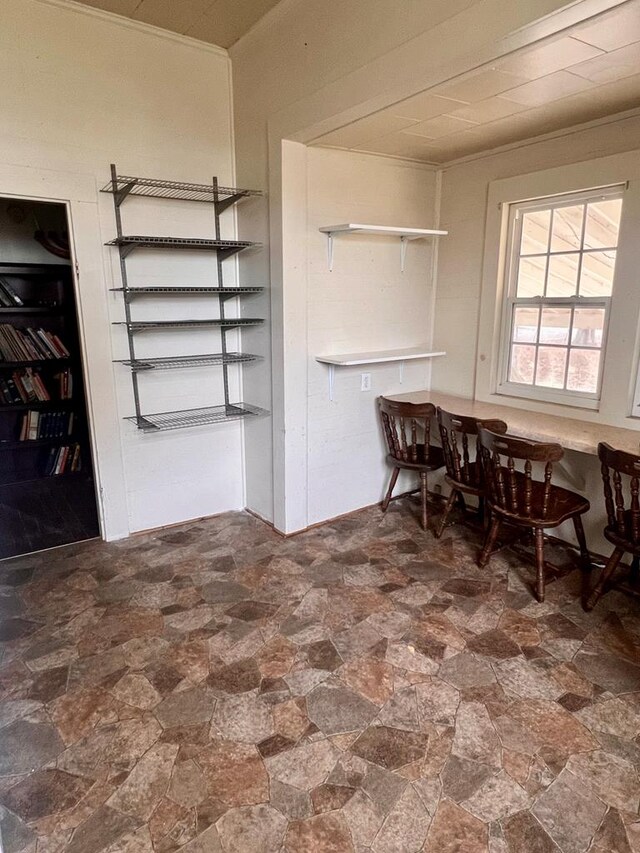 dining area featuring stone finish floor