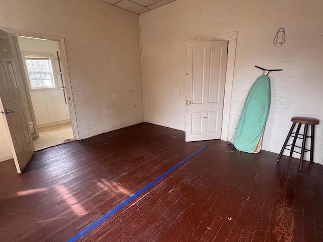 empty room with hardwood / wood-style flooring