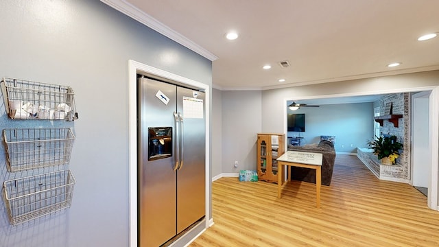 kitchen with ceiling fan, light hardwood / wood-style floors, stainless steel refrigerator with ice dispenser, and ornamental molding