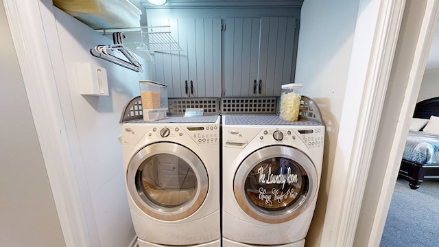 clothes washing area with washer and clothes dryer and carpet floors