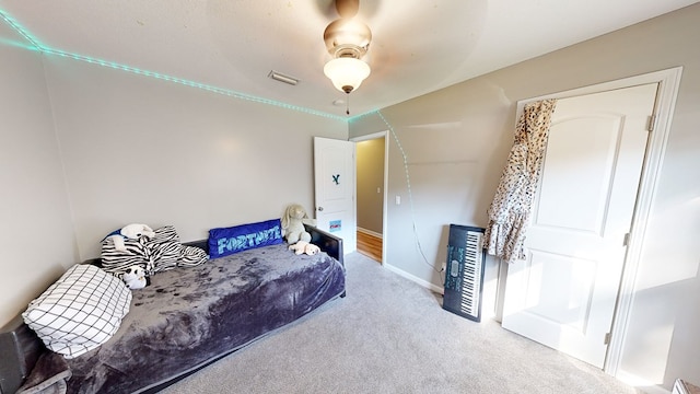 carpeted bedroom featuring ceiling fan