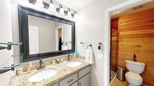 bathroom with tile patterned floors, vanity, and toilet