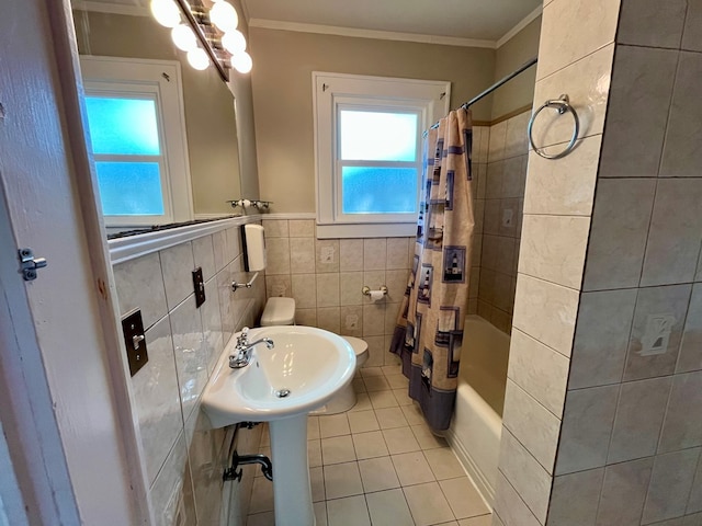 bathroom featuring shower / tub combo with curtain, crown molding, sink, tile walls, and tile patterned flooring