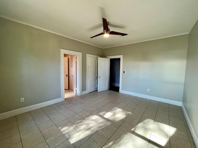 unfurnished bedroom featuring ceiling fan, ornamental molding, and light tile patterned floors