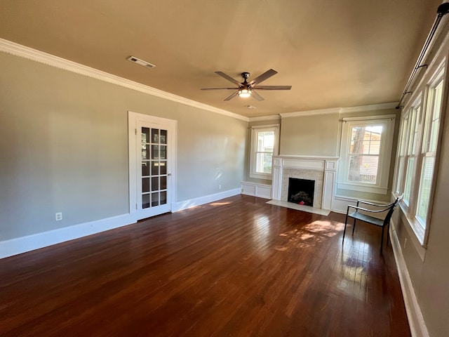 unfurnished living room with ceiling fan, dark hardwood / wood-style flooring, and ornamental molding