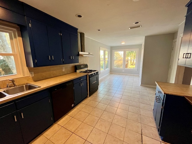 kitchen featuring black appliances, light tile patterned flooring, sink, and extractor fan