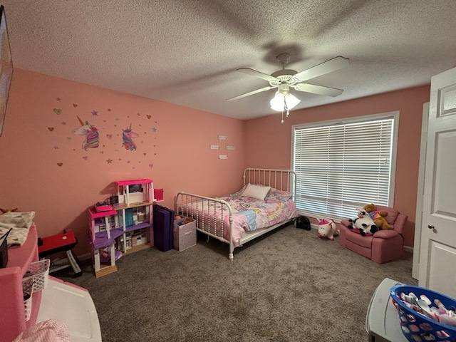 carpeted bedroom featuring ceiling fan and a textured ceiling