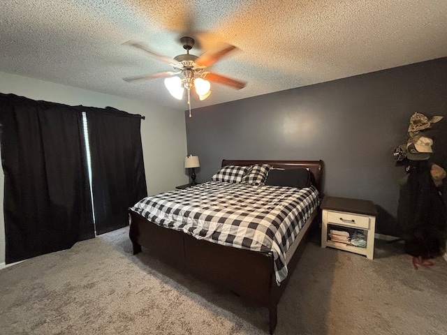 bedroom with carpet, a textured ceiling, and ceiling fan