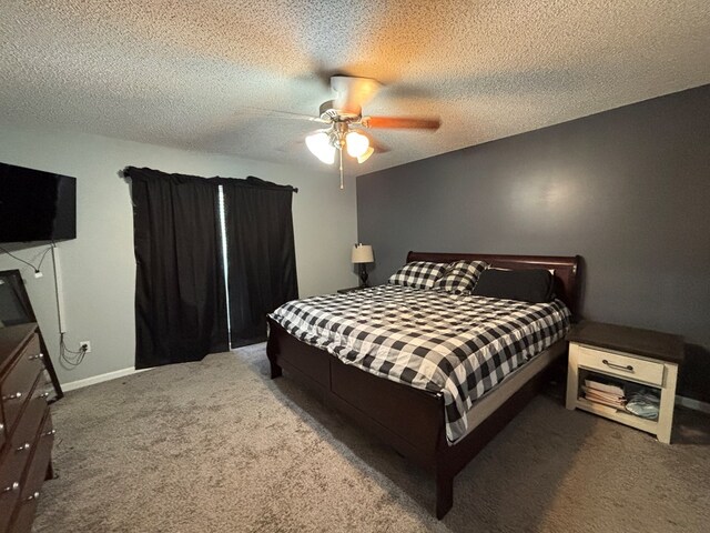 carpeted bedroom featuring a textured ceiling and ceiling fan