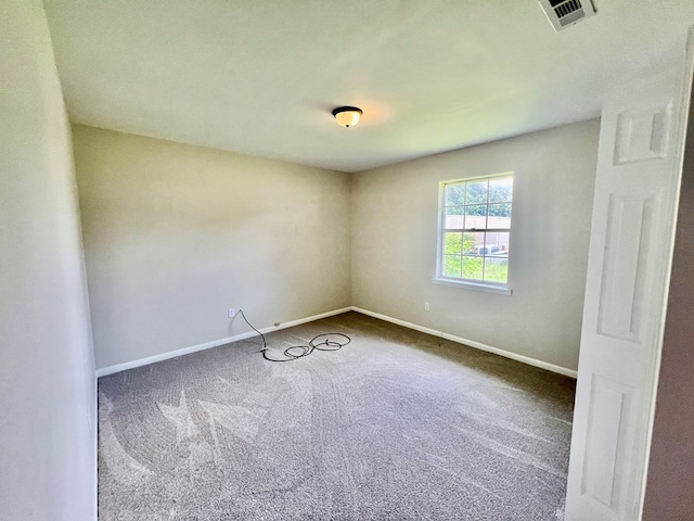 unfurnished room with carpet flooring