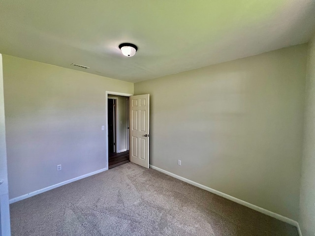 spare room featuring carpet flooring