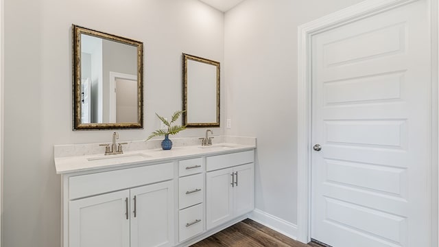 110 Creekridge St, Headland, AL 36345 - bathroom with wood finished floors, double vanity, and baseboards