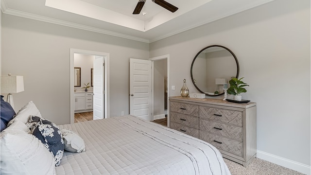 110 Creekridge St, Headland, AL 36345 - bedroom featuring a tray ceiling, crown molding, baseboards, connected bathroom, and a ceiling fan