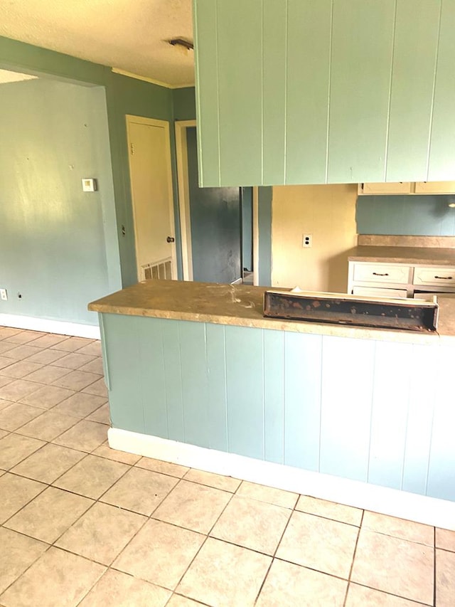 kitchen featuring light tile patterned floors and visible vents