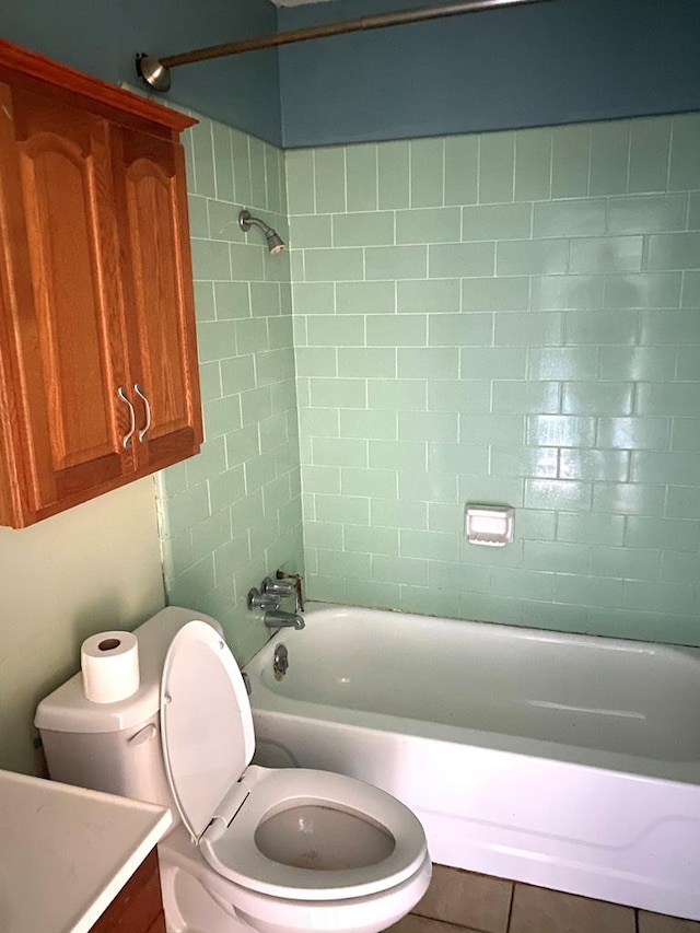 bathroom with toilet, tile patterned flooring, bathtub / shower combination, and vanity