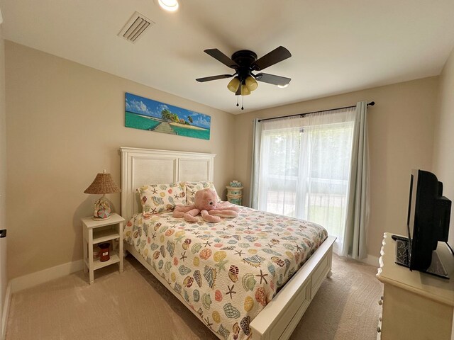 bedroom with light colored carpet and ceiling fan