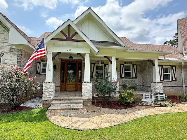 craftsman house featuring a porch and a front yard