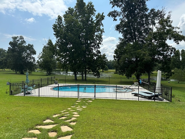 view of swimming pool with a yard and a patio