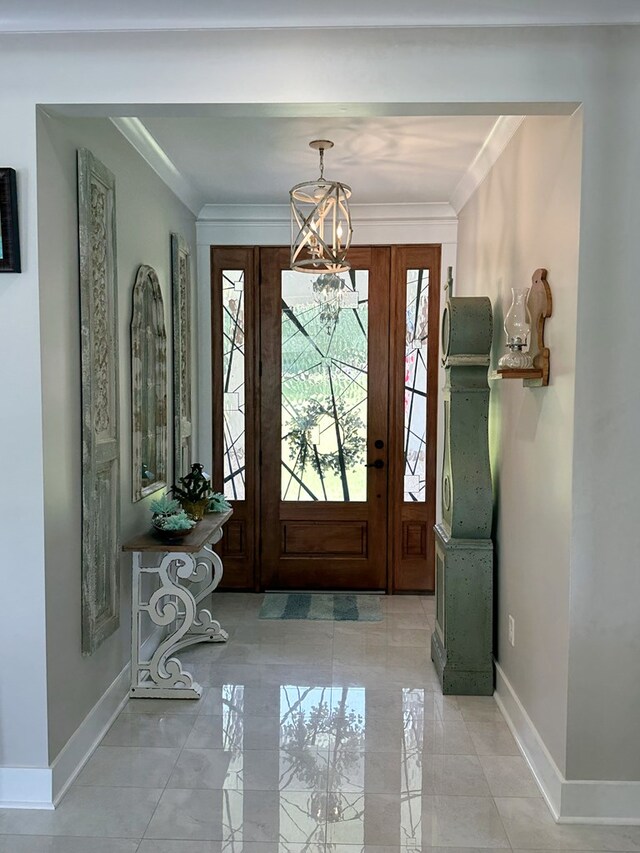 entryway featuring an inviting chandelier and ornamental molding