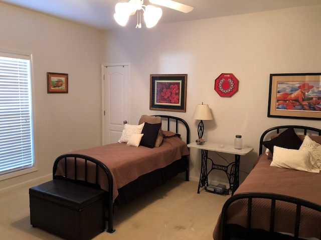 bedroom featuring ceiling fan and light colored carpet