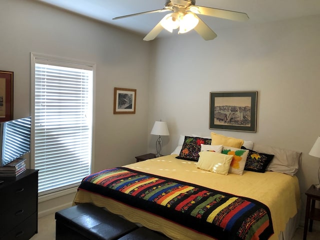 bedroom with ceiling fan and carpet floors