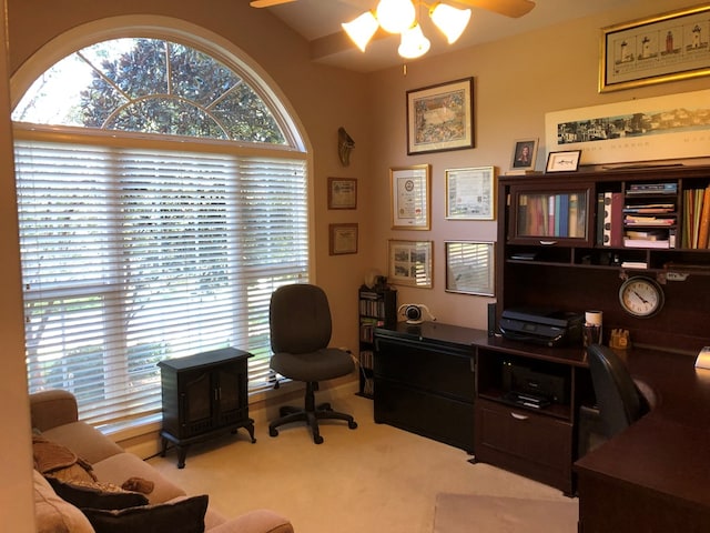 carpeted office with ceiling fan