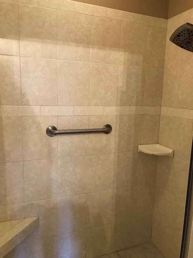 bathroom with tiled shower