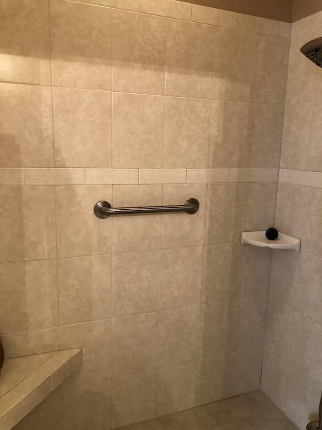 bathroom with a tile shower