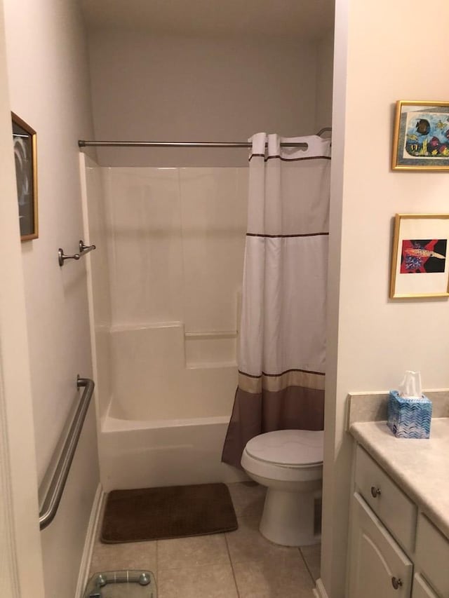 full bathroom featuring tile patterned floors, vanity, shower / bath combination with curtain, and toilet