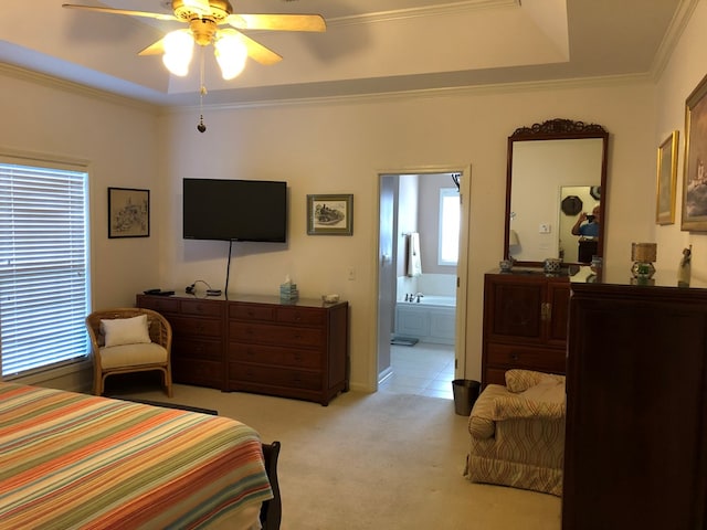 carpeted bedroom with ensuite bath, ceiling fan, and ornamental molding