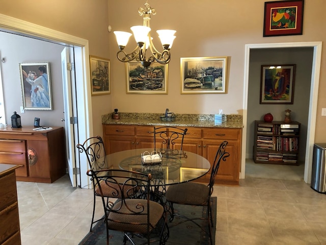 dining room featuring light tile patterned floors and an inviting chandelier