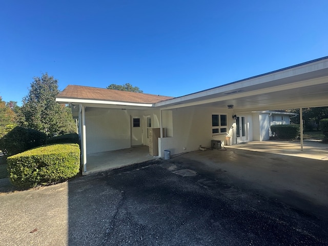 view of home's exterior featuring a carport