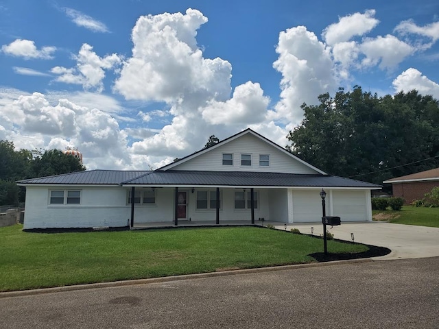 view of front of property with a front lawn, a porch, and a garage