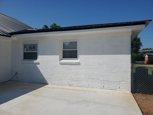 view of side of home featuring a patio area