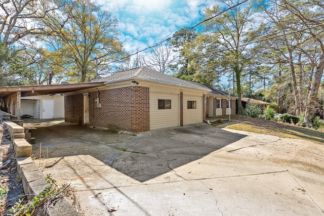 view of property exterior featuring a carport