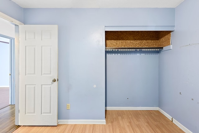 unfurnished bedroom with wood-type flooring