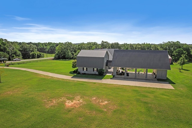 back of house with a lawn