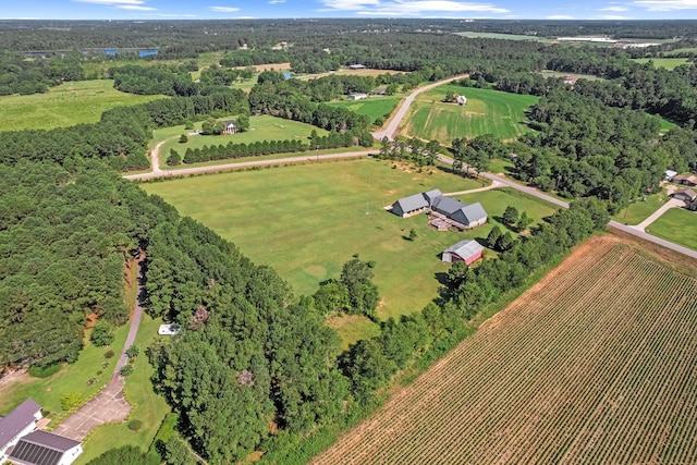 birds eye view of property with a rural view