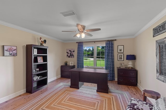 office featuring light wood-type flooring, ceiling fan, and crown molding