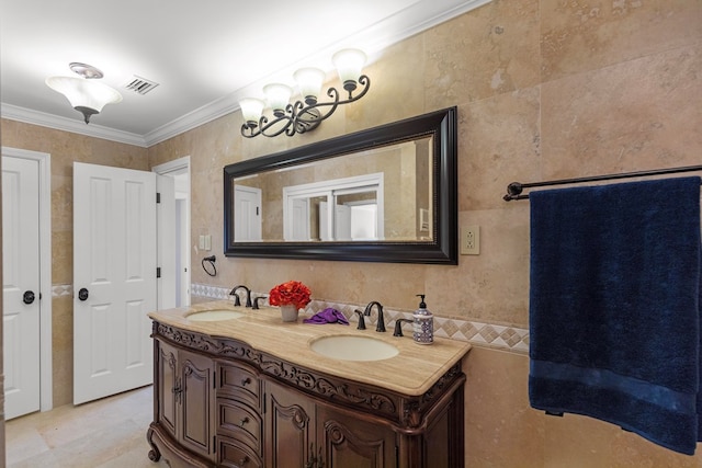 bathroom with vanity, crown molding, and tile walls