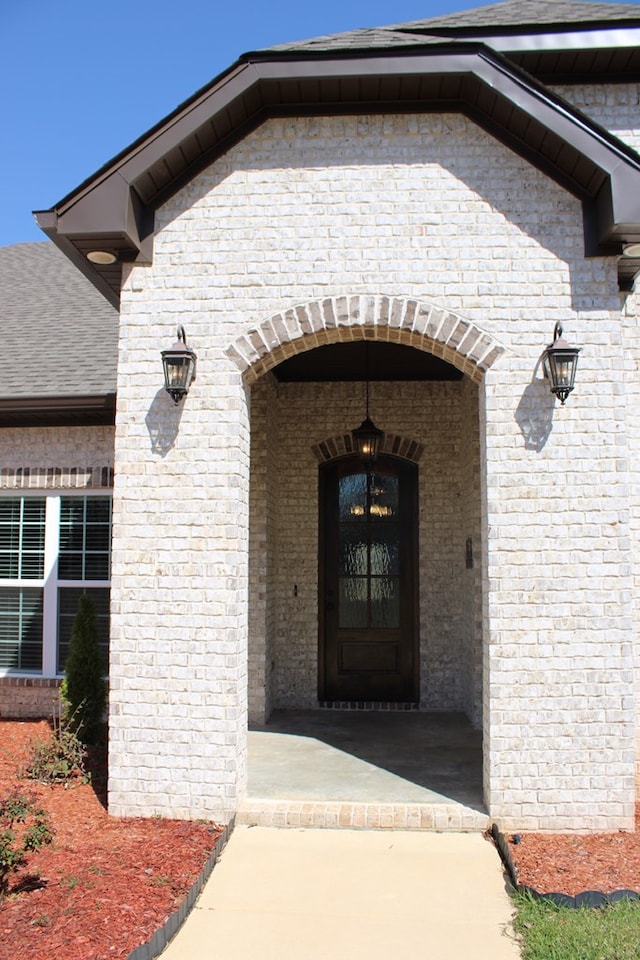 entrance to property with brick siding