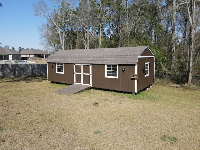 view of shed with a fenced backyard