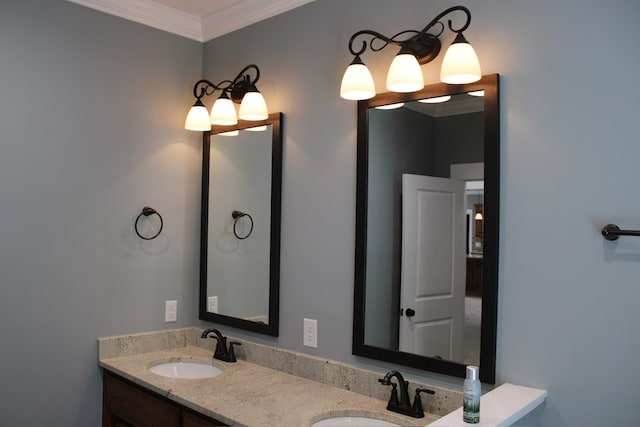 bathroom with double vanity, crown molding, and a sink