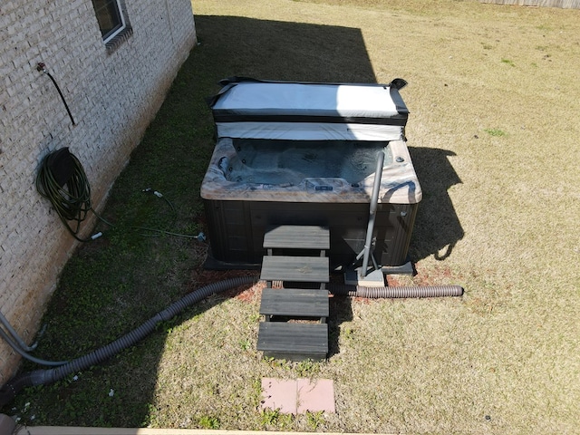 exterior details with a hot tub