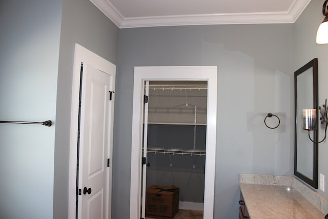 bathroom with vanity and crown molding