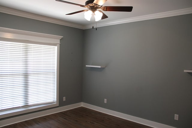 empty room with crown molding, baseboards, dark wood-style flooring, and ceiling fan